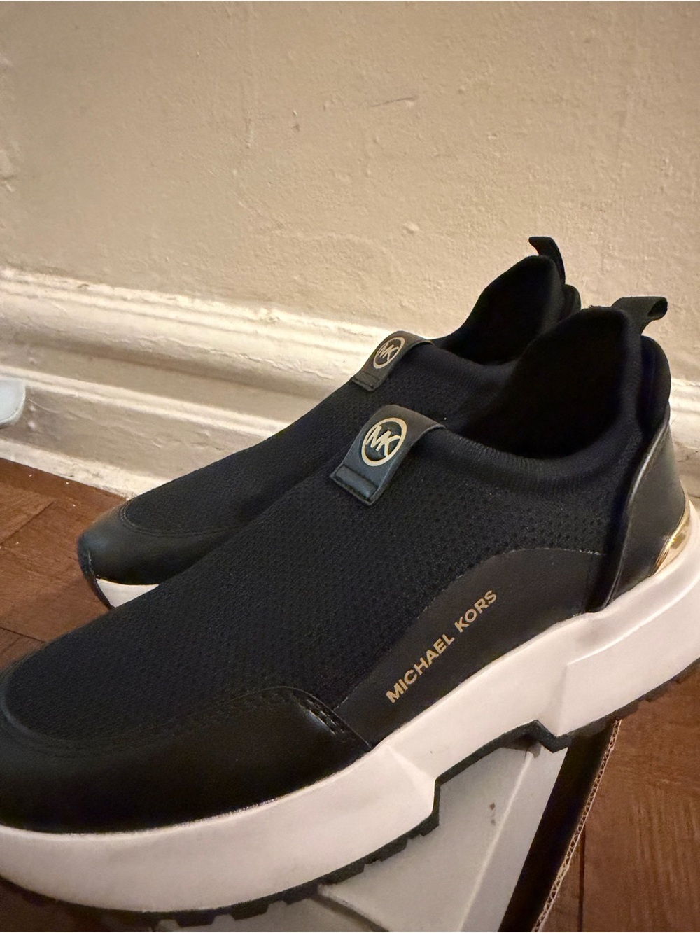 Michael Kors Black Slip-On Knit Sneakers with Gold Accents